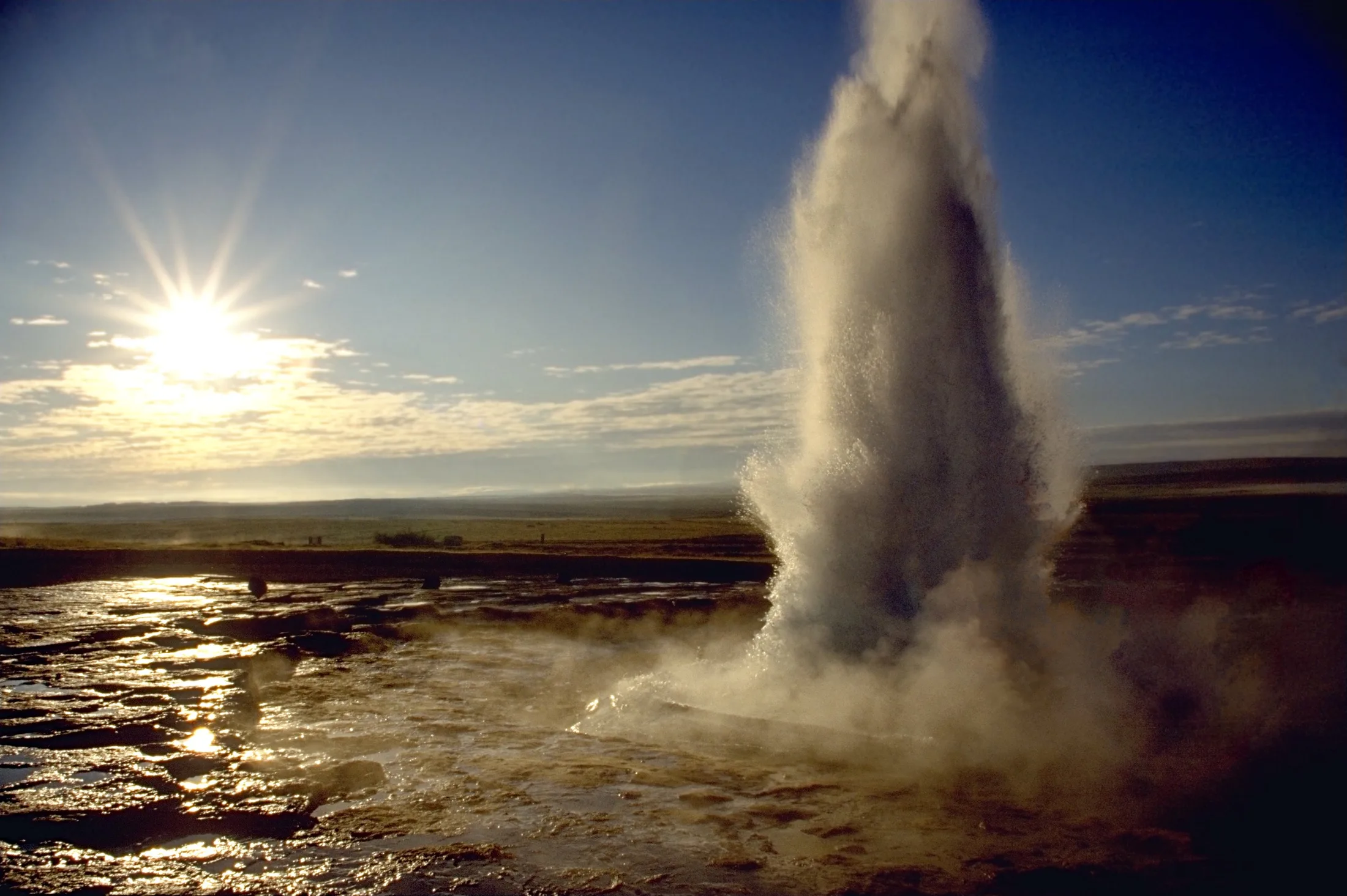 Daytime exterior of Strokkur geyser eruption, close-up view